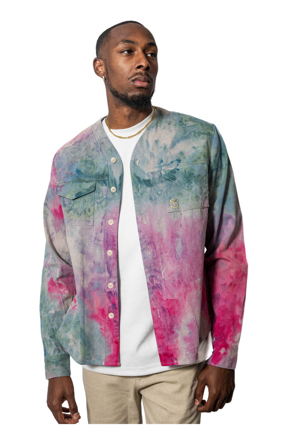 Model wearing a colorful tie-dye shirt over a white t-shirt