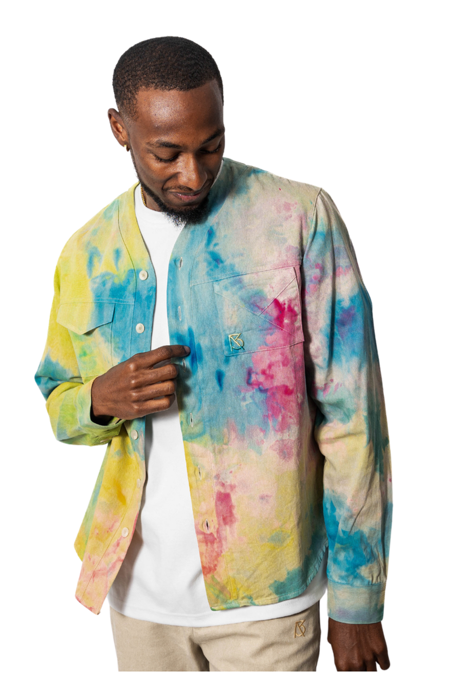 Model wearing a colorful tie-dye shirt