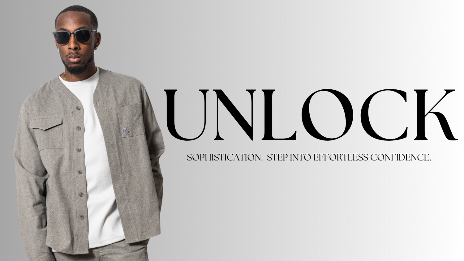Model in gray Brian Americus Herman V-neck button up shirt, blending sports heritage with sleek, minimalist fashion.