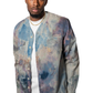 Model wearing a colorful patterned shirt over a white t-shirt 