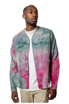 Model wearing a colorful tie-dye shirt over a white t-shirt 