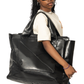 Lifestyle shot of Minoso Faux Leather Tote Bag by Brian Americus, styled with urban fashion for a modern, on-the-go look.